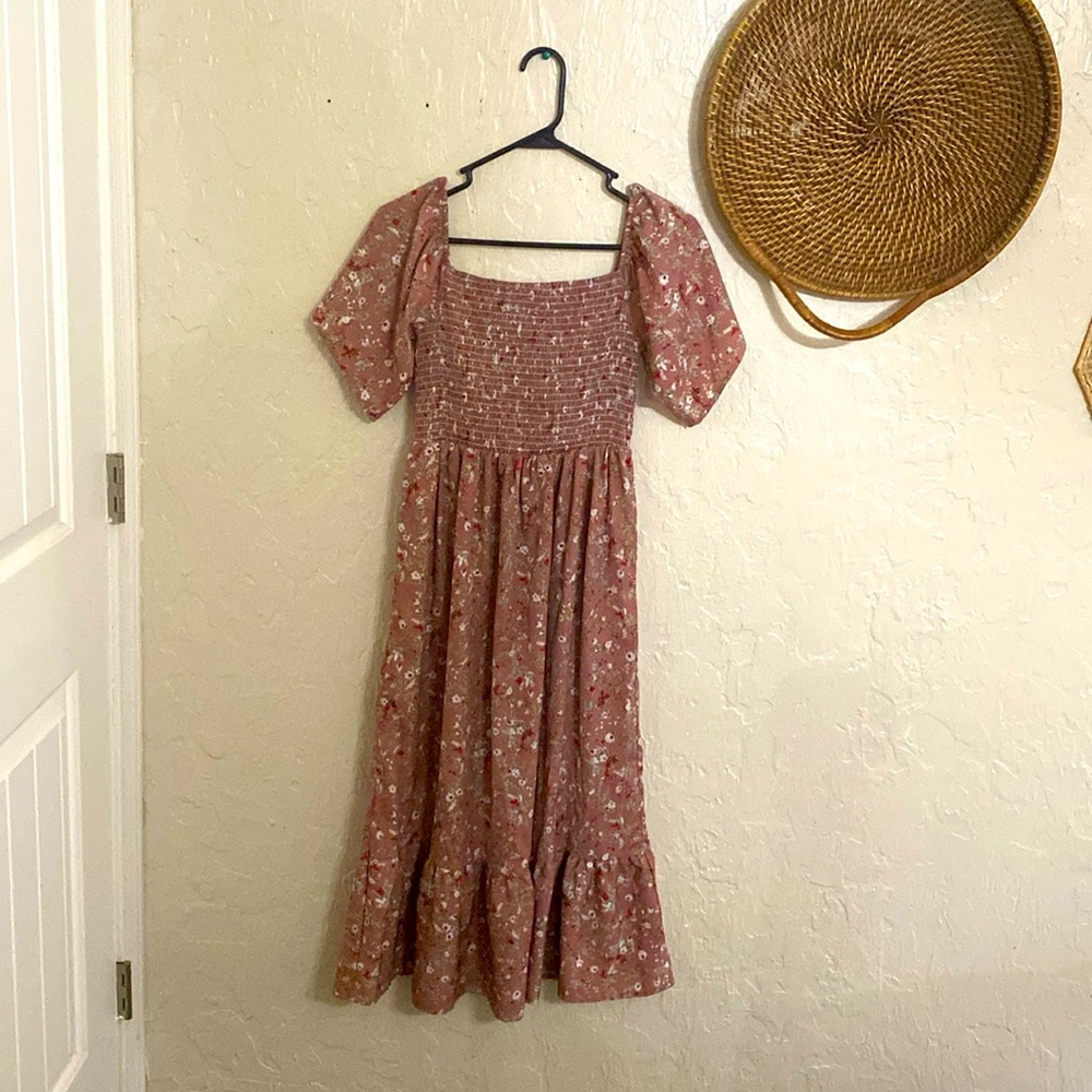 This is a purple dress with little flowers on it it’s a perfect summer dress🥰❤️